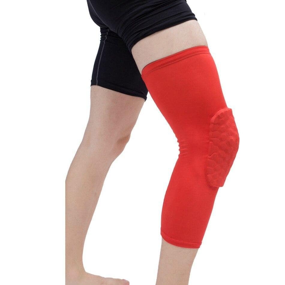 a woman in a red shirt and black shorts