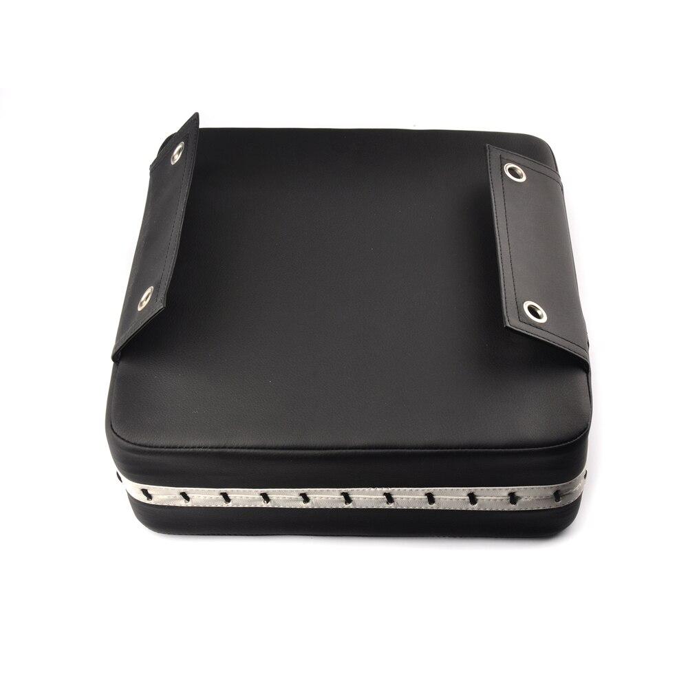 a black piece of luggage sitting on top of a table