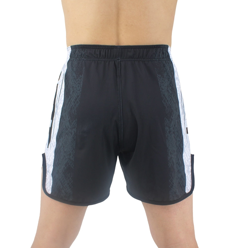 a man in a black shirt and black shorts