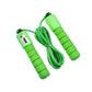 a close up of a green and white toothbrush 